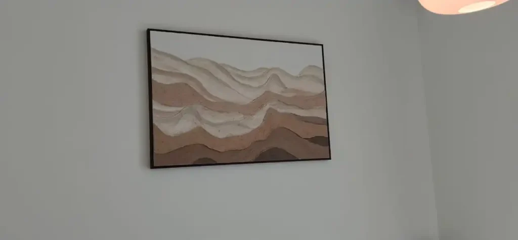 a painting hanged by smart hands in burj crown downtown dubai