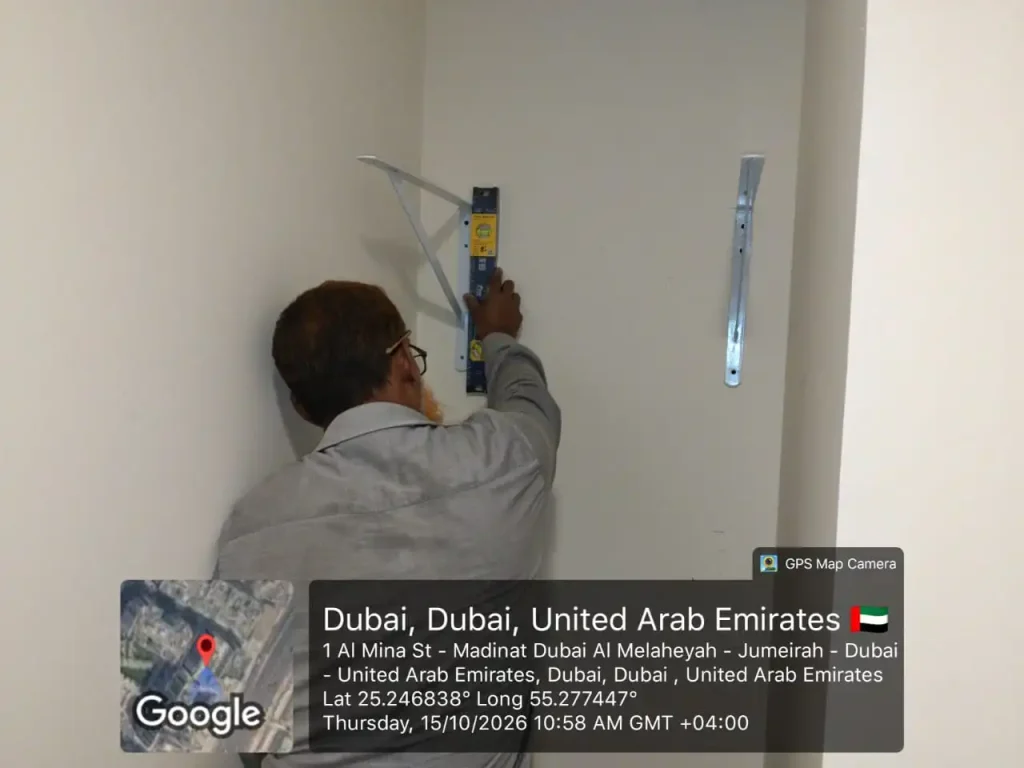 Smart Hands's team installing shelves in Dubai