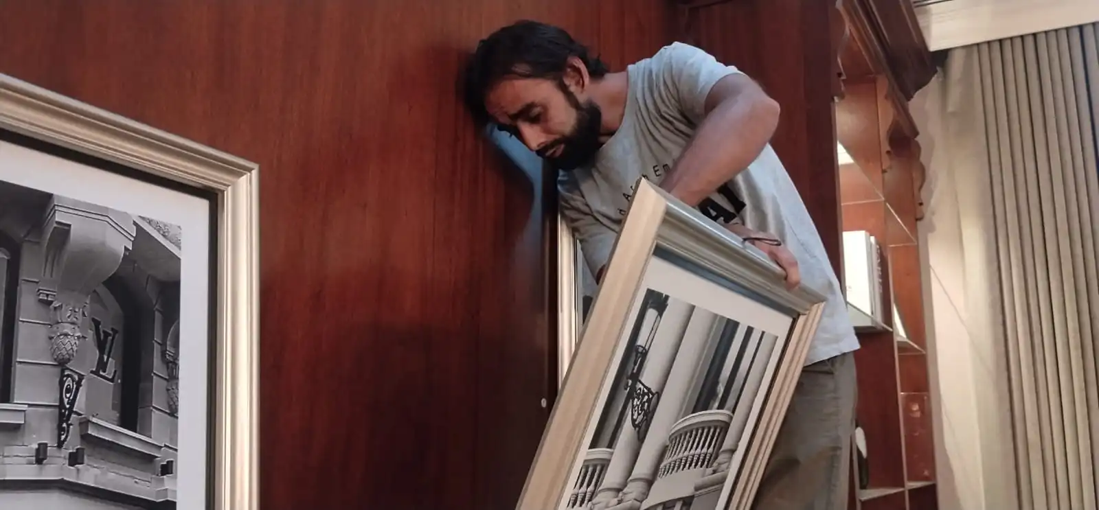 Hanging frame on wooden panel for a client in nad al sheba