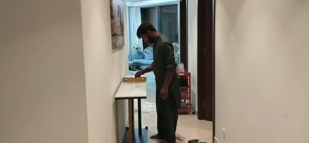 Our Handyman checking the level of tabled installed