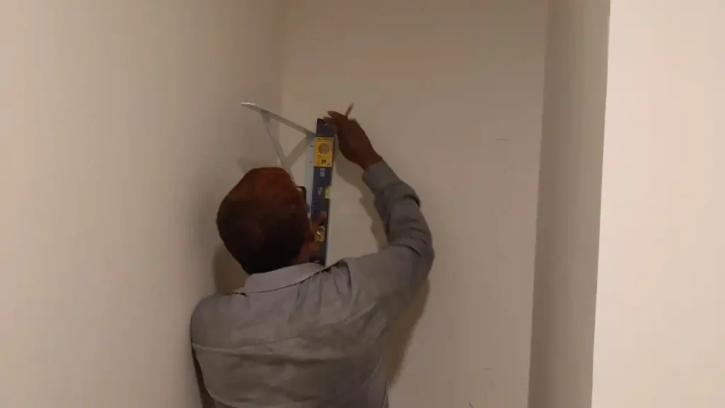 smart hands carpenter installing shelves in dubai